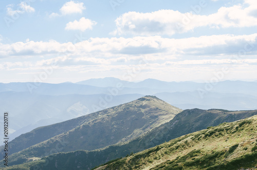Fototapeta Naklejka Na Ścianę i Meble -  Mountains hills landscape green clouds