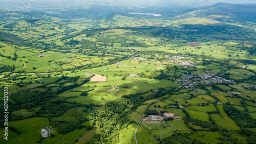 Aerial view of green farmland and fields in the rural Welsh countryside © whitcomberd