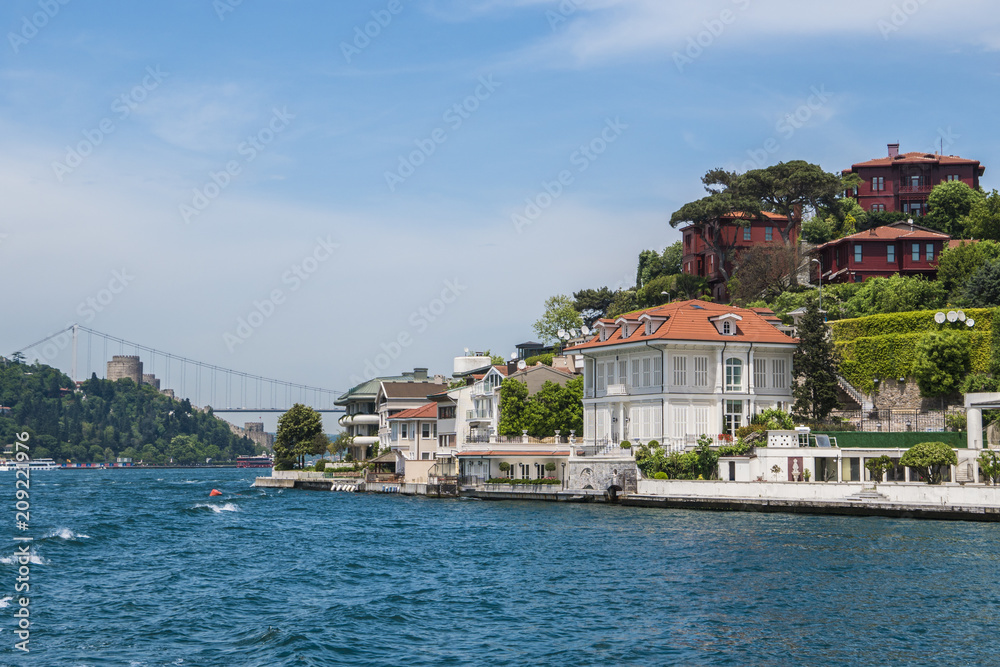 Beautiful View of Bosphorus Coastline in Istanbul with Exquisite wooden Houses and Boat