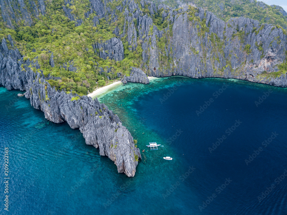 Aerial drone view of a tropical island and beach (Miniloc Island)