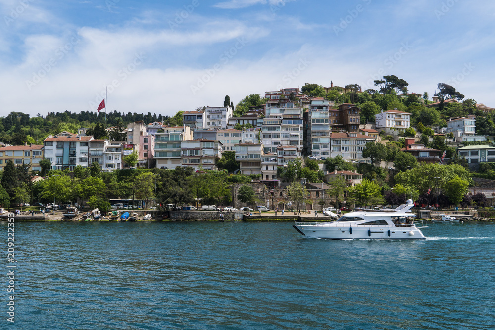 Beautiful View of Bosphorus Coastline in Istanbul with Exquisite wooden Houses and Boat