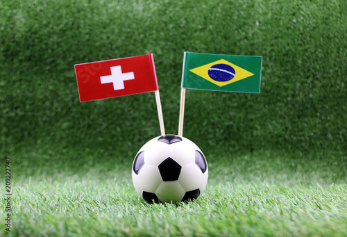 ball with Brazil VS Swiss flag match on Green grass football 2018