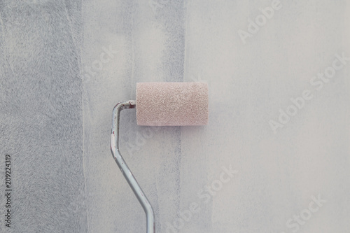 Painting of walls in a white color. Repair in a house.