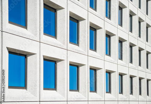 full frame view of modern white house with blue windows in copenhagen  denmark