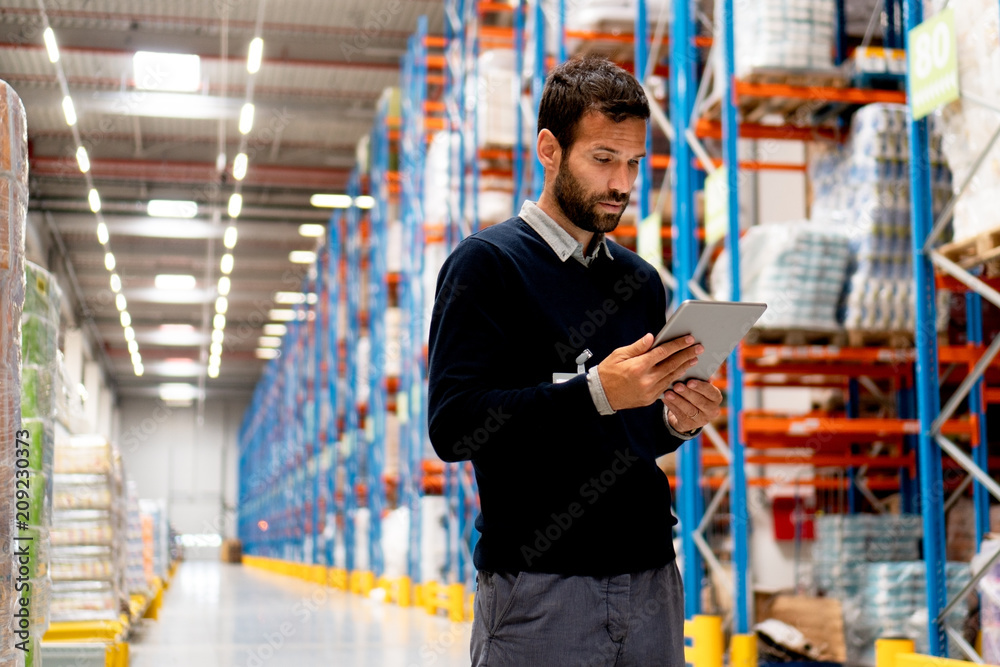 Manager of warehouse holding digital tablet Manager of warehouse holding digital tablet
