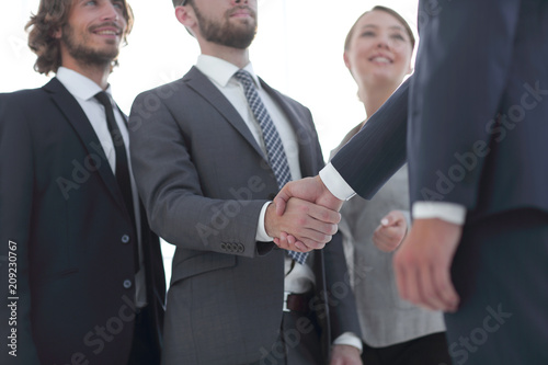 business leader shaking hands with the investor