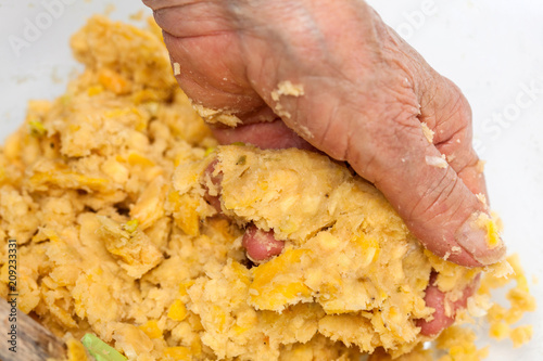 Preparation of plantain croquettes stuffed with pork cracklings photo