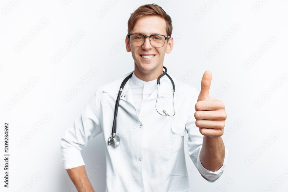 Doctor shows thumb up, success of young student, on white background Doctor shows thumb up, success of young student, on white background