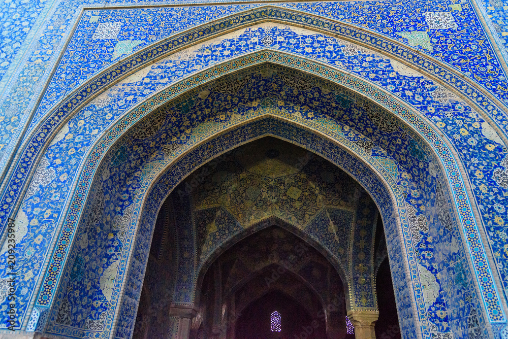 Decorated with colorful tiles of Shah Mosque or Imam Mosque in Isfahan. Iran