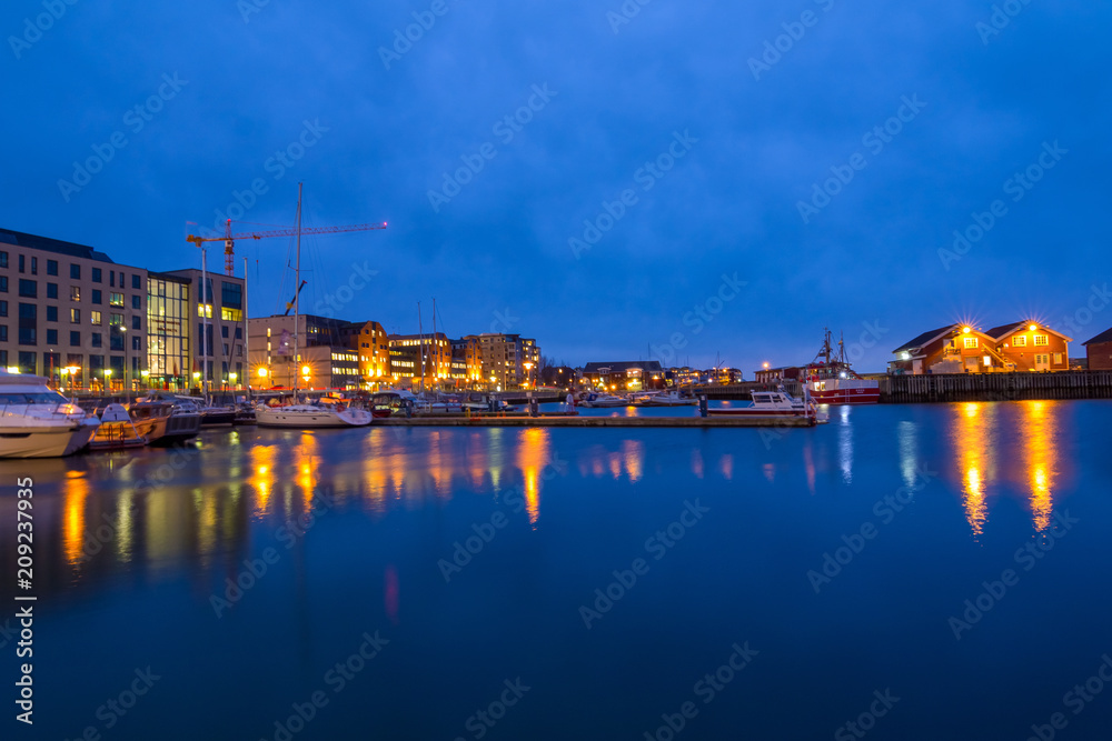 View of the marina and port in Bodo at night. Norway. Skyline of city.