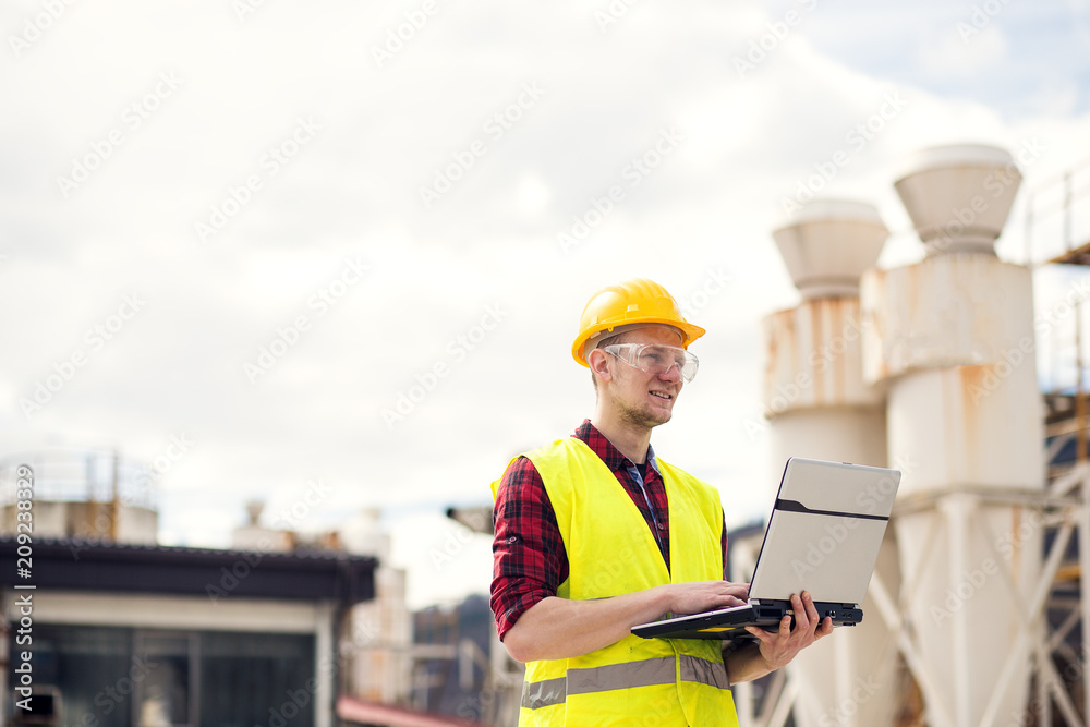 Young engineer using laptop Young engineer using laptop