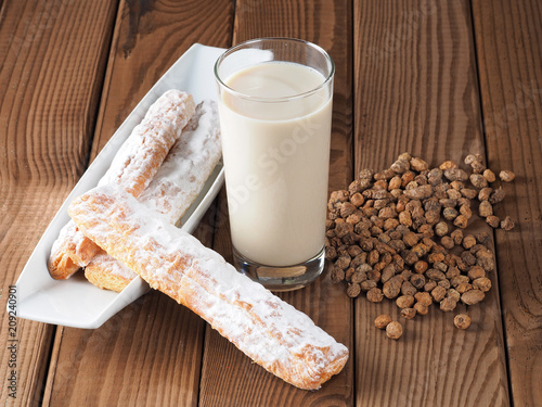 Horchata is a drink, made with the juice of tigernuts and sugar.  Native from Valencia – Spain, it is a refreshing drink, often accompanied with long thin buns called  fartons.