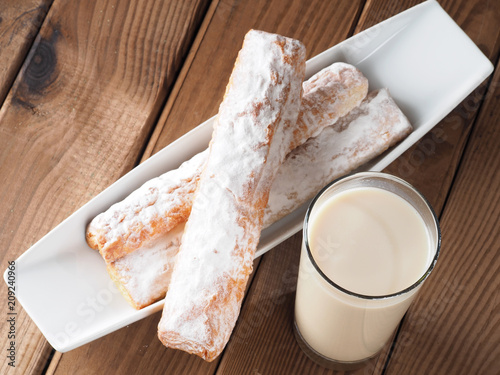 Horchata is a drink, made with the juice of tigernuts and sugar.  Native from Valencia – Spain, it is a refreshing drink, often accompanied with long thin buns called  fartons.