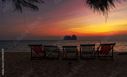 five beach chair on sunset sky twilight