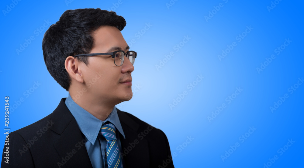 Portrait of young business man on blue background Portrait of young business man on blue background