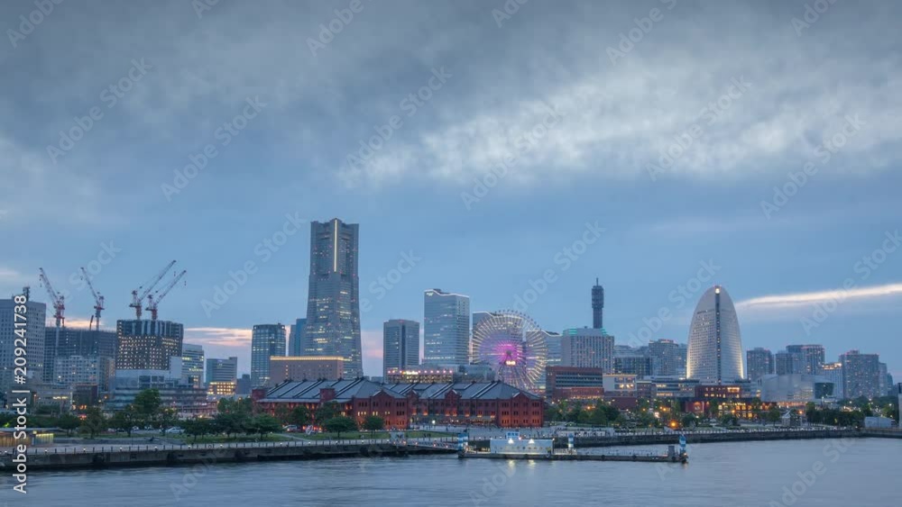 zoom out time lapse of Yokohama skyline day to night transition zoom out time lapse of Yokohama skyline day to night transition