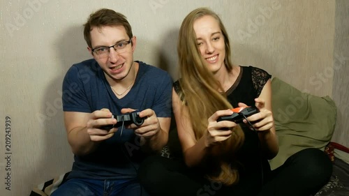 guy and girl are fighting against each other in a game on the gamepads
