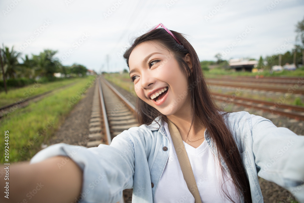 Travel Vacation Tourist Selfie. Asia woman taking self-portrait photo.