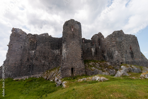 Ruins of an ancient medieval castle on a hillside  Carreg Cennen  Wales  UK 