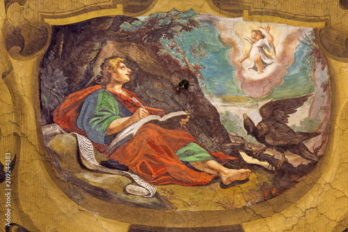 REGGIO EMILIA, ITALY - APRIL 13, 2018: The fresco of Vision of St. John the Evangelist on the Patmos island in church Chiesa di San Giovanni Evangelista by  Tommaso Sandrini (1613). photo