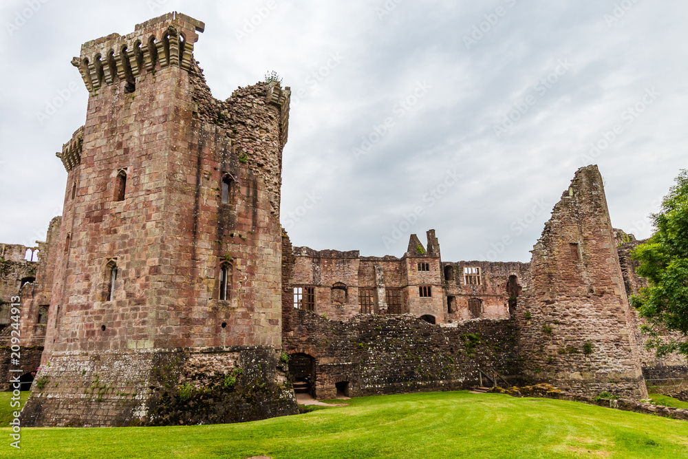 Walls and towers of a ruined ancient medieval castle (Raglan Castle)