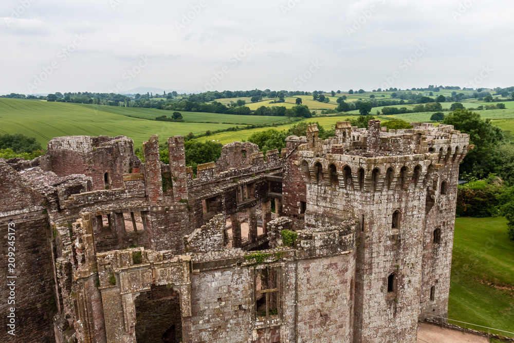 Ramparts and towers of a ruined medieval castle (Raglan Castle, Wales)