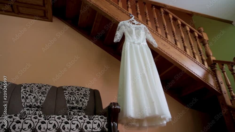 The perfect wedding dress in the room of the bride.