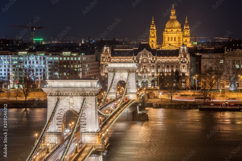 Night View of the Szechenyi Chain Bridge and church St. Stephen's in Budapest