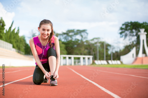 Young Asia woman runner relaxing after workout