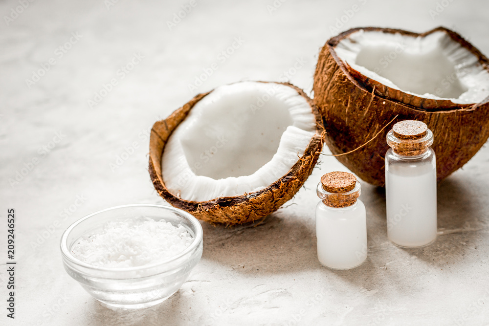 fresh coconut with cosmetic oil in jar on white background fresh coconut with cosmetic oil in jar on white background