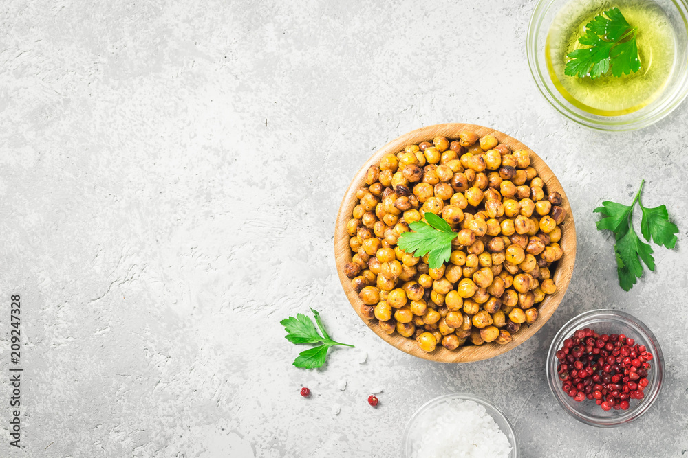 Vegan healthy snack,spicy roasted chickpeas in bowl.Top view, space for text. Vegan healthy snack,spicy roasted chickpeas in bowl.Top view, space for text.