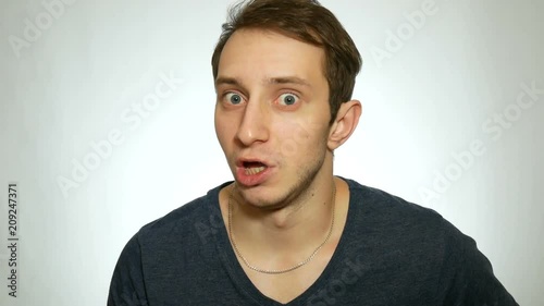 man talking while looking at camera