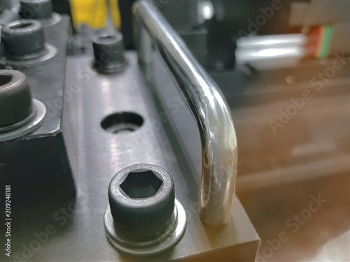 Close-up Fasteners on Blurred Background of Industrial Machinery