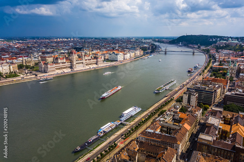 Budapest, Hungary - Aerial skyline view of Budapest with Houses of Parliament, Szechenyi Chain Bridge and sightseeing boats on River Danube