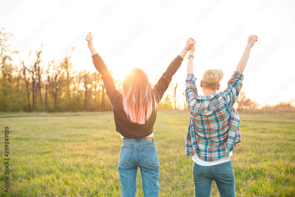 Fototapeta premium Two young women looking on the sunset.