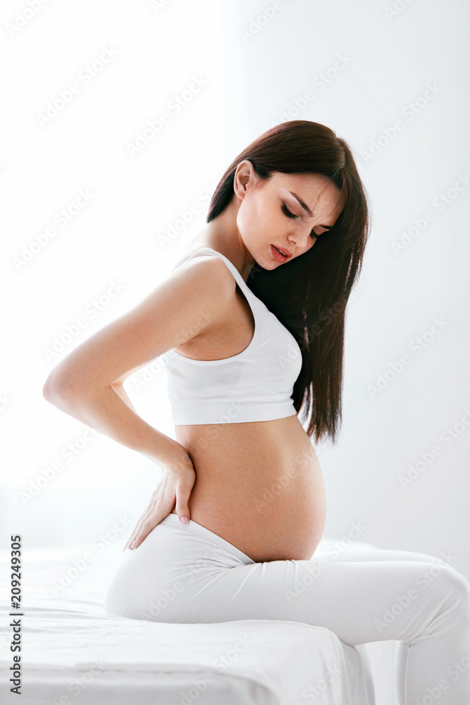 Pregnancy Pain. Pregnant Woman Feeling Back Pain