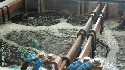 Galvanic bath, Engineering production. Circuit board in galvanic bath in the workflow