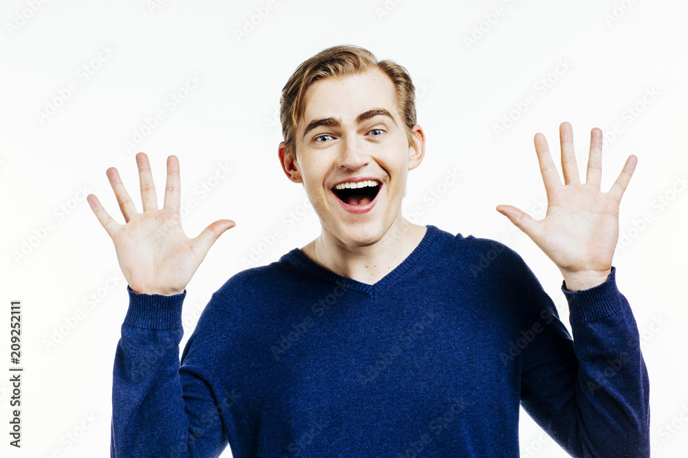 smiling man with both hands next to his face and mouth open smiling man with both hands next to his face and mouth open