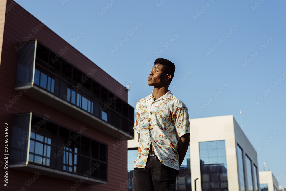 Stylish black man standing on street Stylish black man standing on street