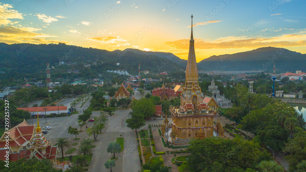 aerial view sunset at beautiful pagoda in Chalong temple Phuket Thailand. Chalong temple is a land mark for tourists. all tourists like to visit Chalong temple