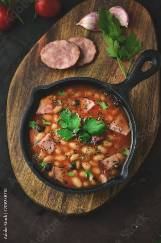 Baked beans with sauce and sausage photo