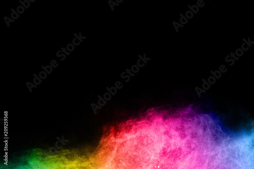 Multicolor powder explosion on black background. 