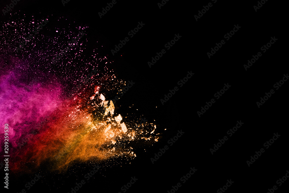 Multicolor powder explosion on black background. 