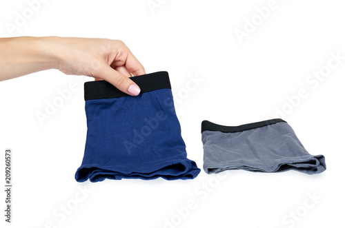 Underpants and clothing for kids with hand isolated on white background photo