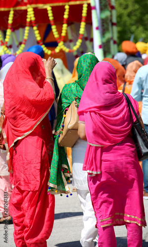 many sikh women during the religious celebration photo