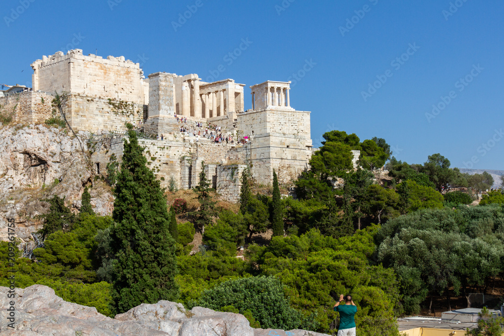 Fototapeta premium Tourist taking a photo of the Acropolis of Athens, Greece