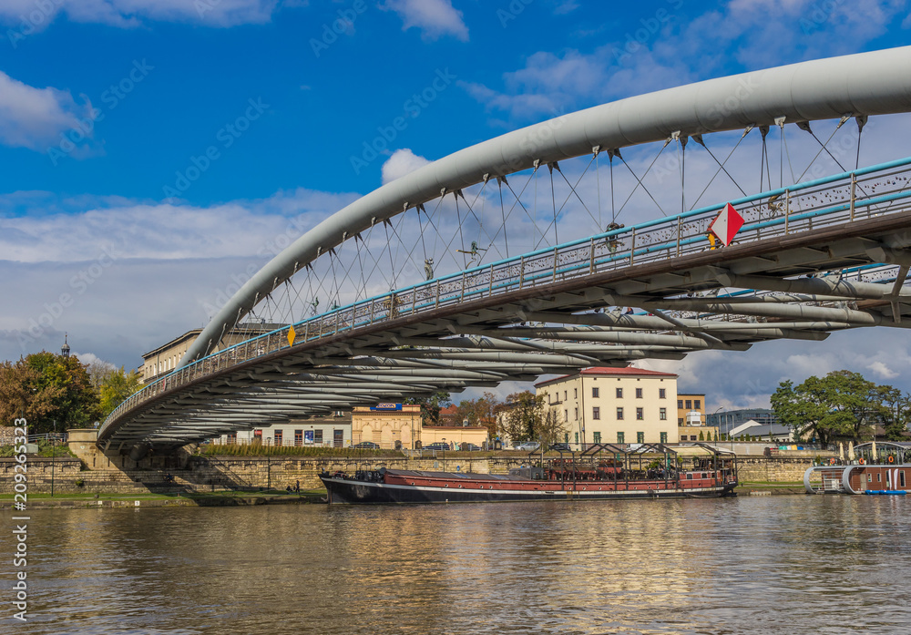 Fototapeta premium Krakow, Poland - the second biggest city in Poland, Krakow offers a mix of history and modernity. Here in the picture a perspective of the Ojca Bernatka bridge, over the Vistula river