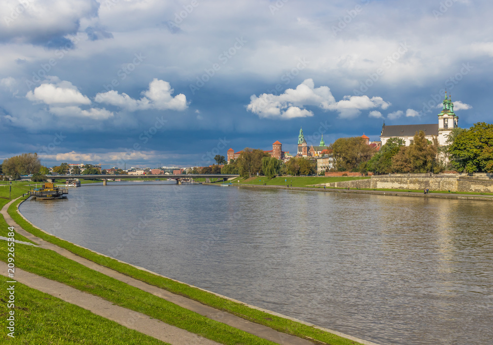 Krakow, Poland - the second biggest city in Poland, Krakow offers a mix of history and modernity. Here in the picture a perspective of the Old Town see from the Vistula river, which cuts the city