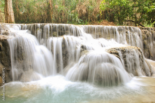 Kuang Si Falls nearby Luang Prabang, Laos. Wild forest, nature landscape. Long exposure shot waterfalls