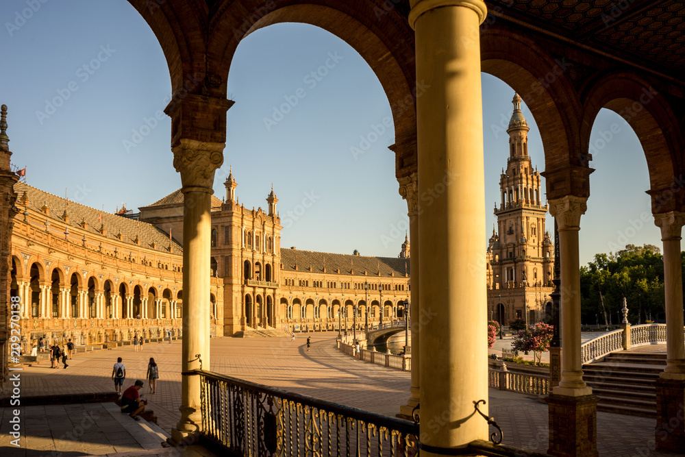 Spain, Seville, GROUP OF PEOPLE IN CITY AGAINST CLEAR SKY at Plaza de Espana